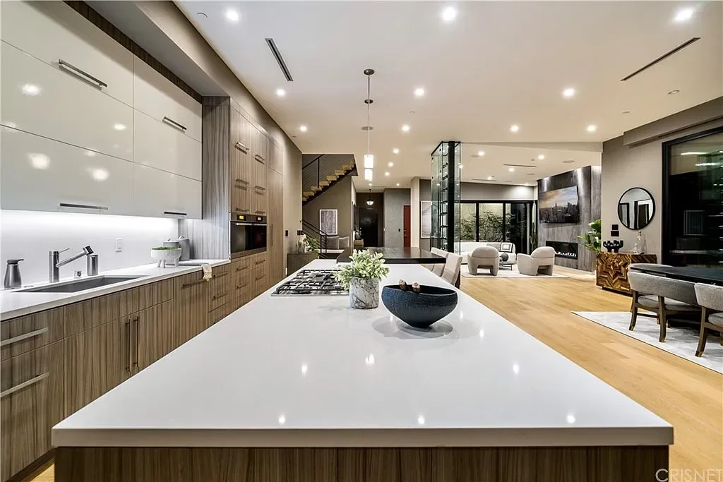 Kitchen cabinetry and stone countertop at Xuxi Builds’ Villa Laurel; material palette inspiration.